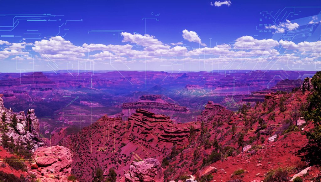 A vibrant red canyon landscape overlaid with digital circuit board graphics