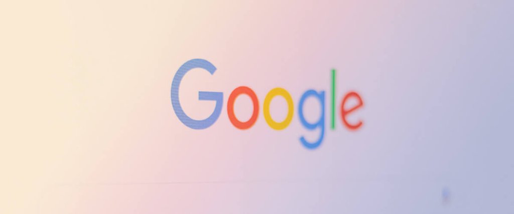 The Google logo displayed on a soft, light-colored background