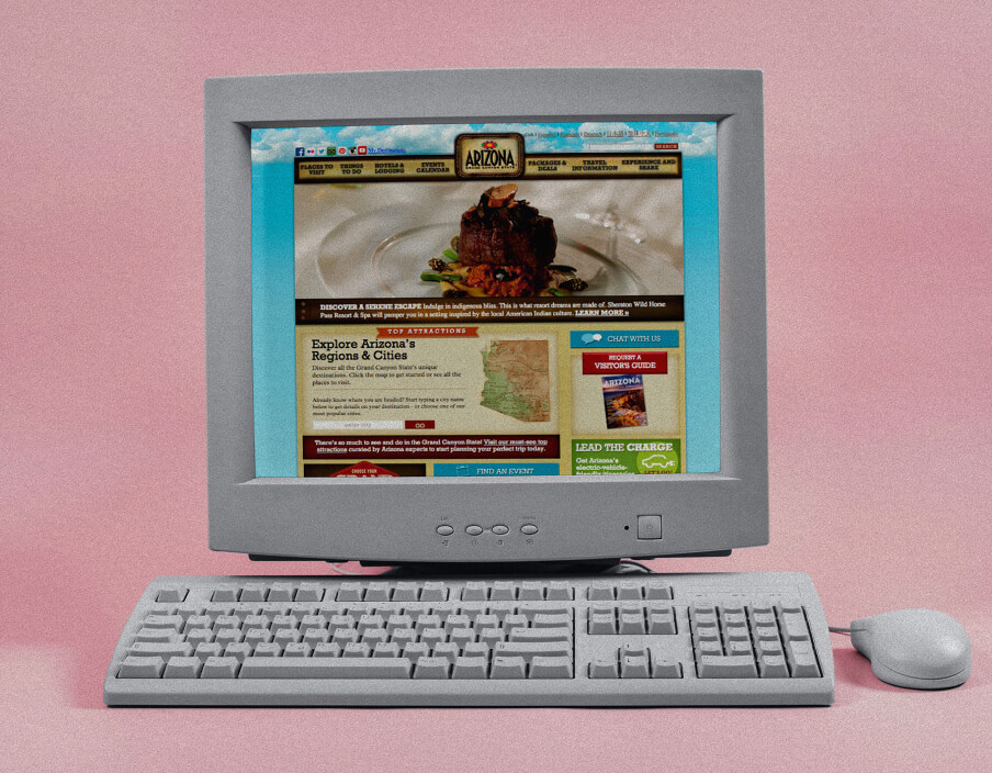 A retro computer displays a website about Arizona on a pink background
